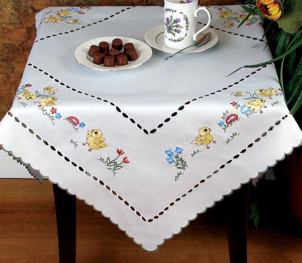 XD54016 Easter Egg Hunt Table Topper featuring baby chicks, flowers, and Easter eggs in vibrant colors, perfect for festive table settings.